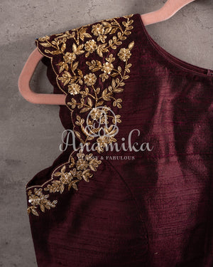 Brown sleeveless blouse with gold zardosi work on shoulders