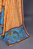 Peach chanderi silk saree with hand painted kalamkari border in blue