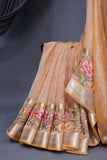 Crushed Tissue saree with an embroidered thread work border