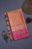 A rich kanjeevaram silk saree in yellow and pink dual tone