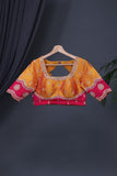 A rich kanjeevaram silk saree in yellow and pink dual tone