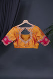A rich kanjeevaram silk saree in yellow and pink dual tone