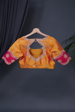 A rich kanjeevaram silk saree in yellow and pink dual tone