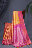 A rich kanjeevaram silk saree in yellow and pink dual tone