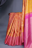 A rich kanjeevaram silk saree in yellow and pink dual tone