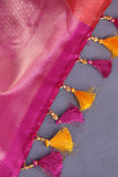 A rich kanjeevaram silk saree in yellow and pink dual tone