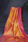 A rich kanjeevaram silk saree in yellow and pink dual tone