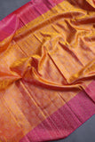 A rich kanjeevaram silk saree in yellow and pink dual tone