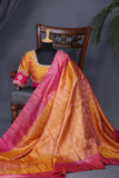 A rich kanjeevaram silk saree in yellow and pink dual tone