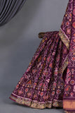Purplish Wine color Pure Patola saree with maggam work border