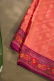 A beautiful kanjeevaram saree in peach with resham thread work floral border