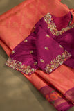 A beautiful kanjeevaram saree in peach with resham thread work floral border