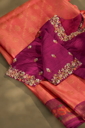 A beautiful kanjeevaram saree in peach with resham thread work floral border