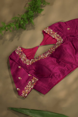 A beautiful kanjeevaram saree in peach with resham thread work floral border