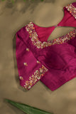 A beautiful kanjeevaram saree in peach with resham thread work floral border