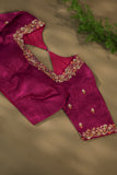 A beautiful kanjeevaram saree in peach with resham thread work floral border