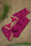 A beautiful kanjeevaram saree in peach with resham thread work floral border