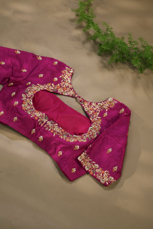 A beautiful kanjeevaram saree in peach with resham thread work floral border