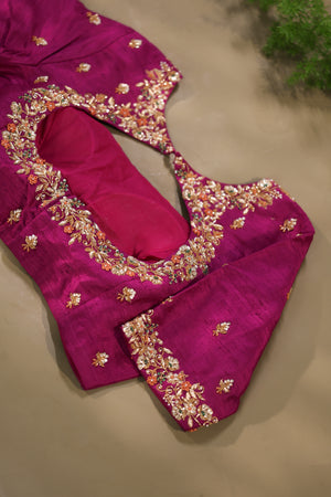 A beautiful kanjeevaram saree in peach with resham thread work floral border