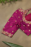 A beautiful kanjeevaram saree in peach with resham thread work floral border