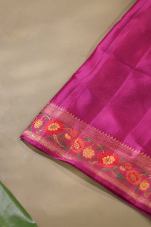 A beautiful kanjeevaram saree in peach with resham thread work floral border