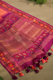 A beautiful kanjeevaram saree in peach with resham thread work floral border