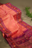 A beautiful kanjeevaram saree in peach with resham thread work floral border