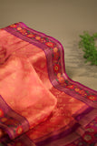 A beautiful kanjeevaram saree in peach with resham thread work floral border