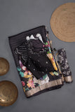 A lovely soft silk floral saree in black with a mirror work blouse