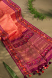 A beautiful kanjeevaram saree in peach with resham thread work floral border