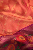 A beautiful kanjeevaram saree in peach with resham thread work floral border