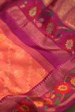 A beautiful kanjeevaram saree in peach with resham thread work floral border