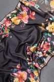 A lovely soft silk floral saree in black with a mirror work blouse