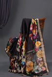 A lovely soft silk floral saree in black with a mirror work blouse