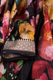A lovely soft silk floral saree in black with a mirror work blouse