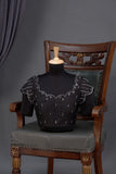 A lovely soft silk floral saree in black with a mirror work blouse