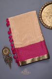 A beautiful mysore crepre silk saree in soft peach and rani pink combination