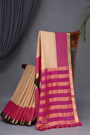 A beautiful mysore crepre silk saree in soft peach and rani pink combination