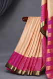 A beautiful mysore crepre silk saree in soft peach and rani pink combination