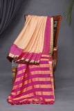 A beautiful mysore crepre silk saree in soft peach and rani pink combination