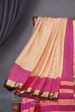 A beautiful mysore crepre silk saree in soft peach and rani pink combination