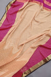 A beautiful mysore crepre silk saree in soft peach and rani pink combination