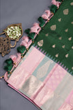 A designer kanjeevaram saree in bottle green with hues of pink border and pallu