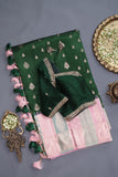 A designer kanjeevaram saree in bottle green with hues of pink border and pallu