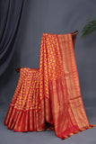 Ikkat Kanchi saree in hues of orange & red - absolutely gorgeous