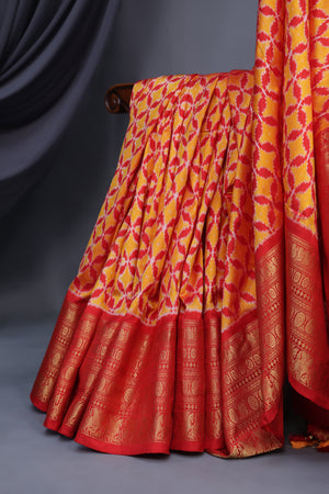 Ikkat Kanchi saree in hues of orange & red - absolutely gorgeous
