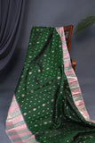 A designer kanjeevaram saree in bottle green with hues of pink border and pallu