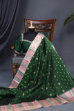 A designer kanjeevaram saree in bottle green with hues of pink border and pallu