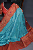 Aqua Blue Gadwal saree with Meenakari floral border in orange