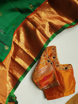 Traditional Green and rust orange Kanchipattu saree
